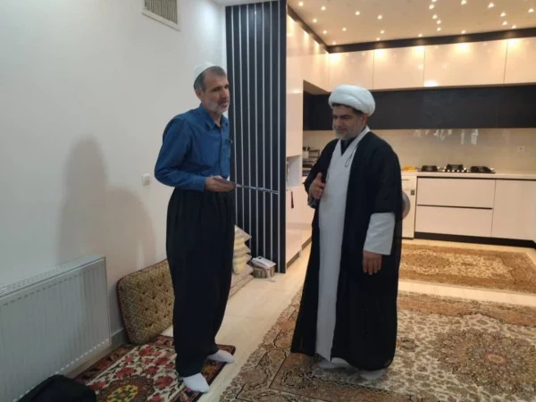 تجلی ایثار و استقامت در دیدار مسئولان دانشگاه فرهنگیان کردستان با خانواده شهید «اقبال احمدی» 9